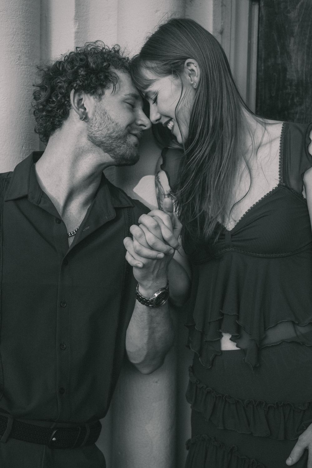A romantic black and white photo series capturing intimate moments between a couple.