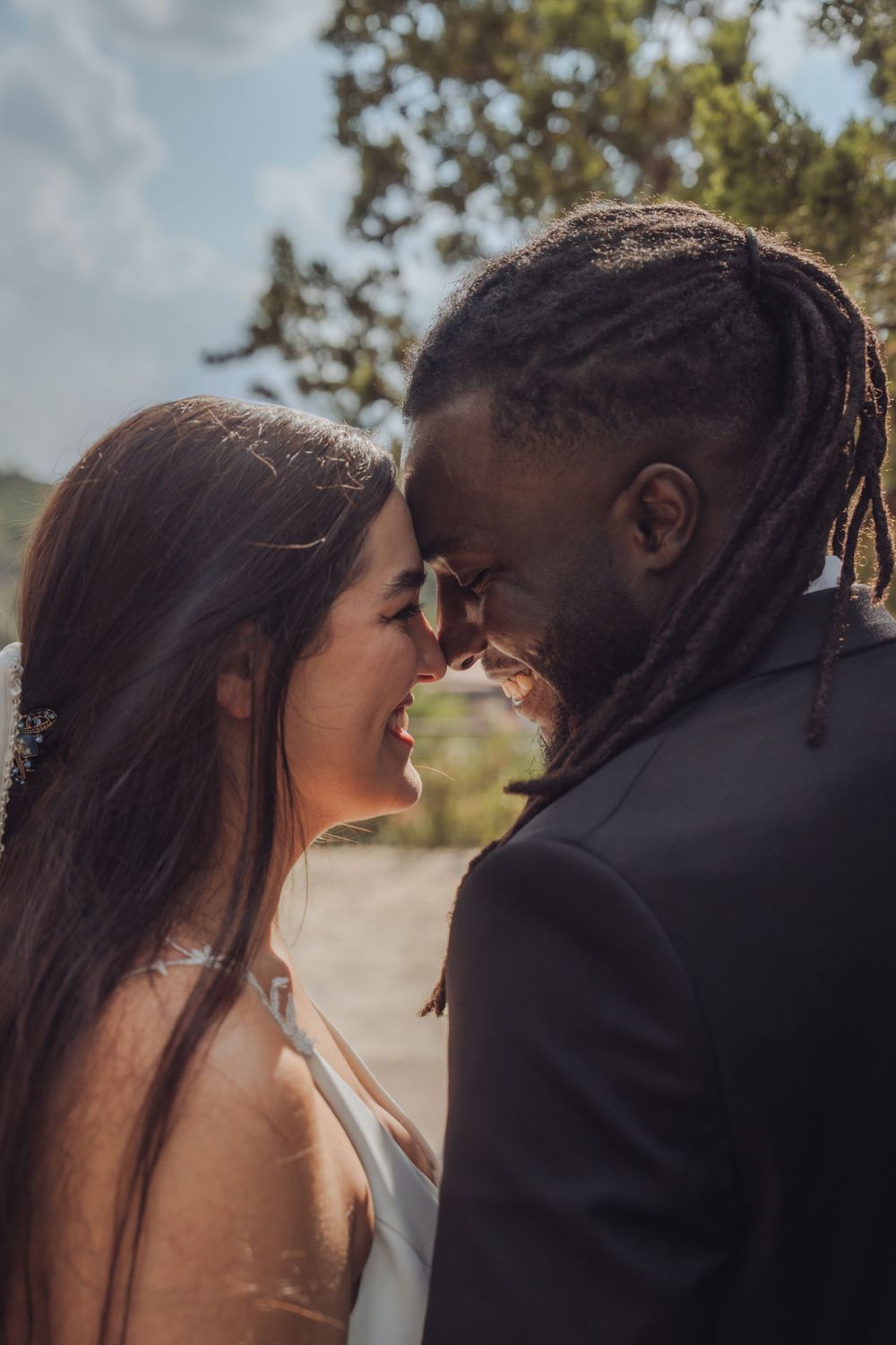 Intimate wedding couple portrait showing tender romantic moment.