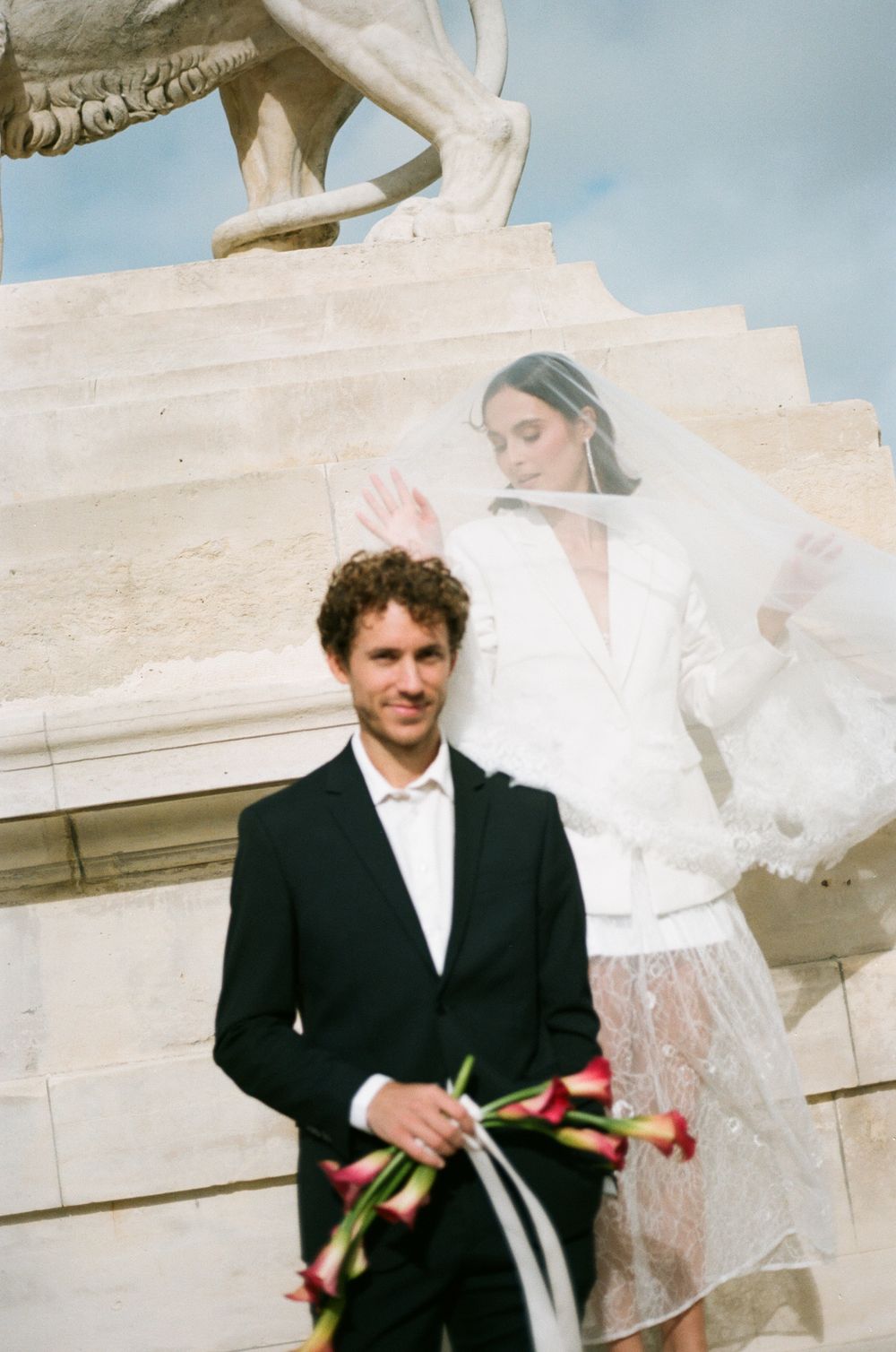 Paris editorial fashion wedding inspiration. Paris film photography with flower bag. Paris veil wedding photos. Stylish Paris elopement.