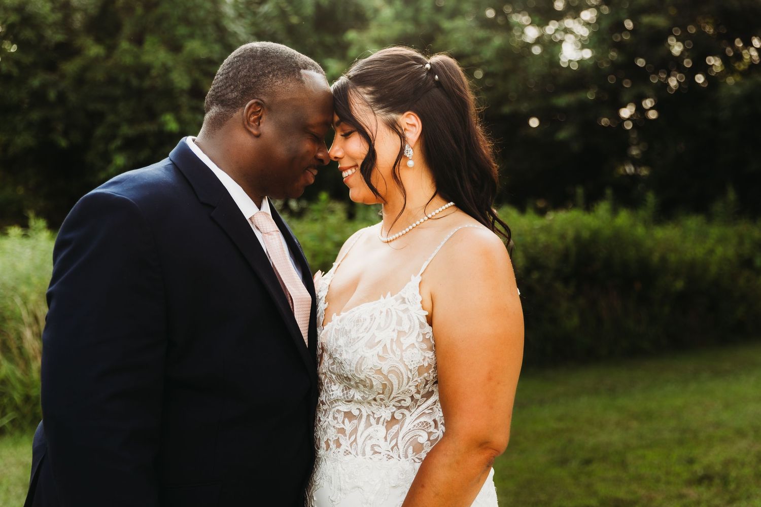 Intimate wedding couple portraits in natural outdoor setting during golden hour in Southern Maryland. Annapolis videographer