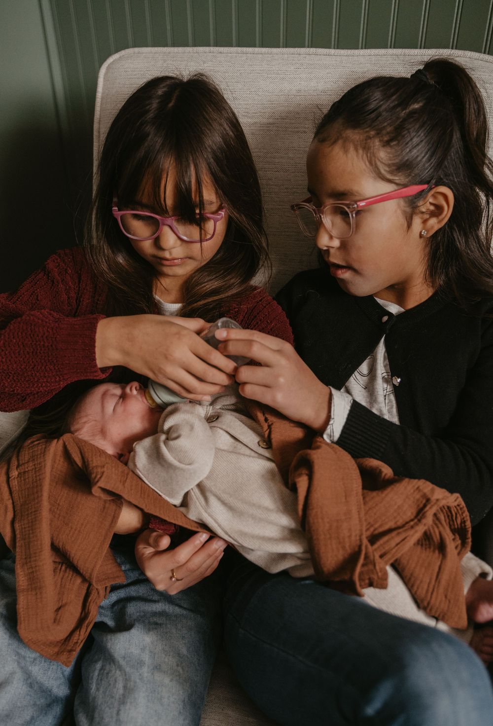 Sequence of tender moments between siblings sharing affectionate interactions in warm brown tones.