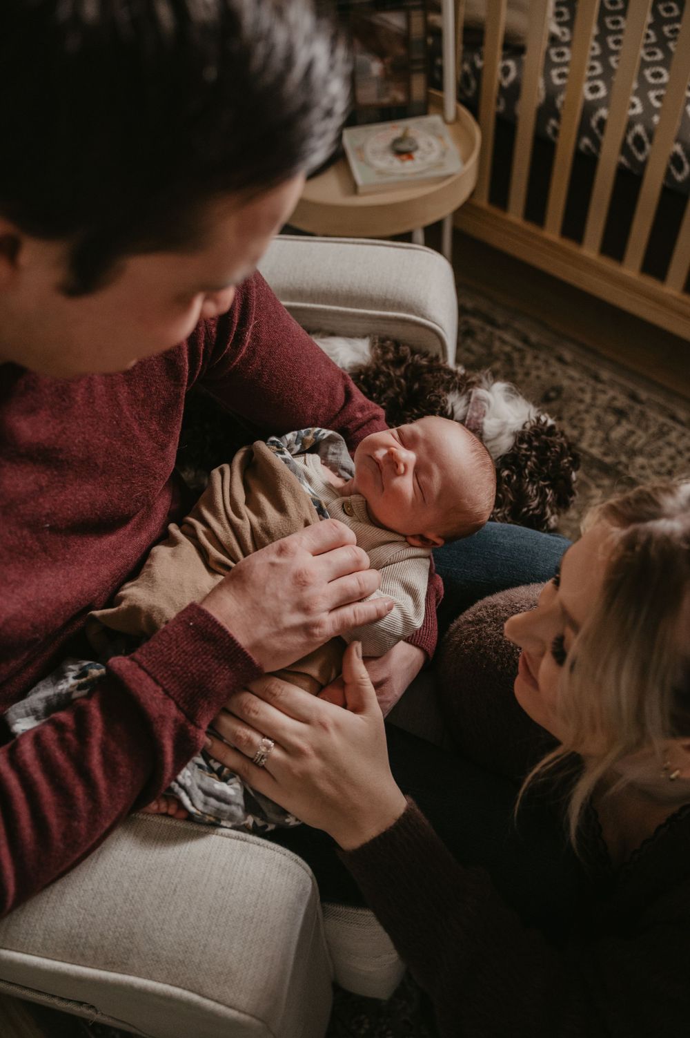 Series of intimate family moments showing gentle interaction with a baby on a couch.