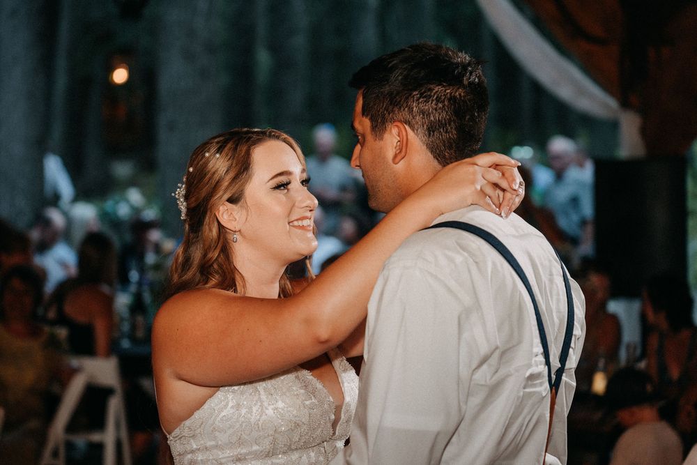 A romantic first dance moment captured at an evening wedding reception.
