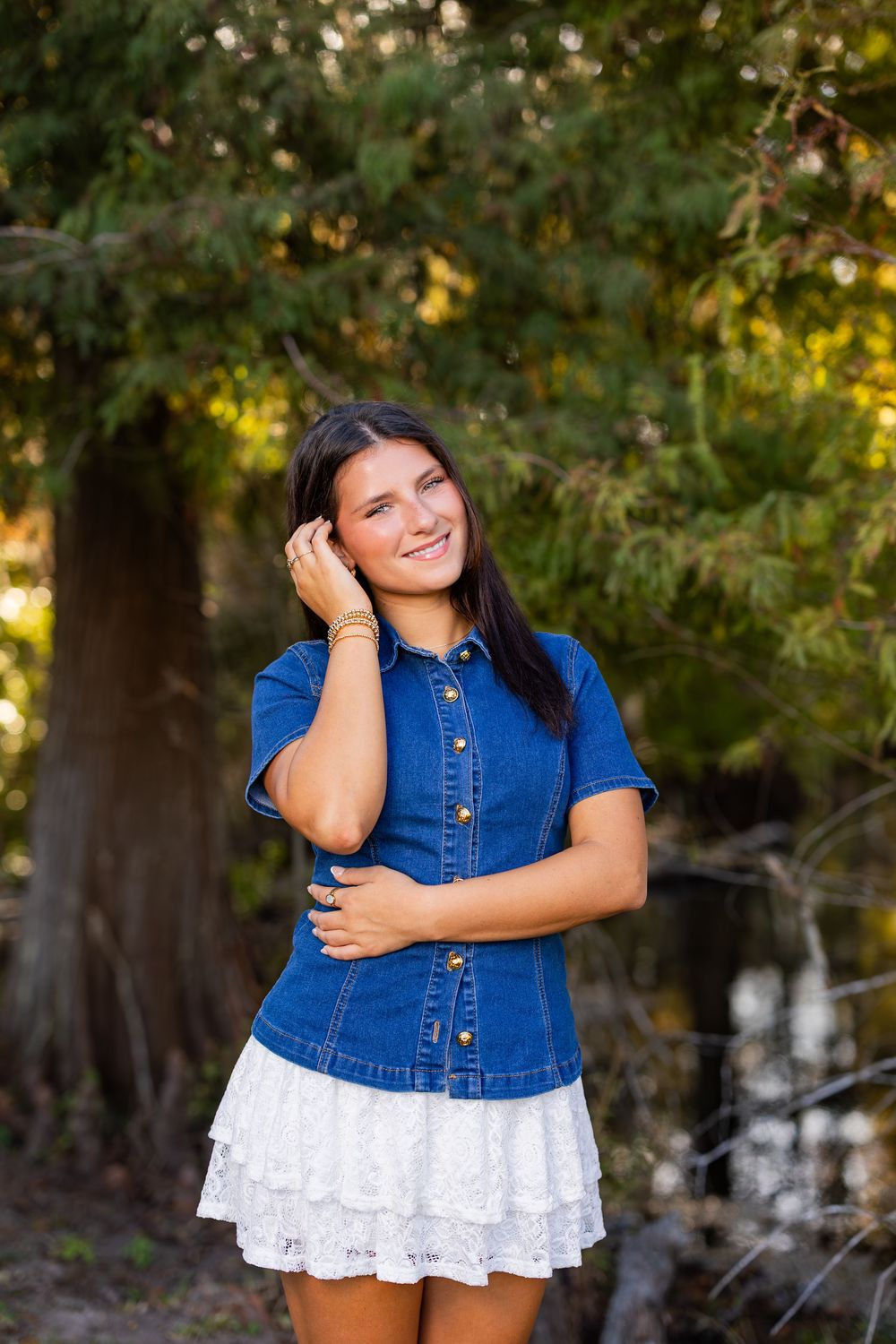 Summer fashion shoot combining denim and white lace in a natural woodland setting.