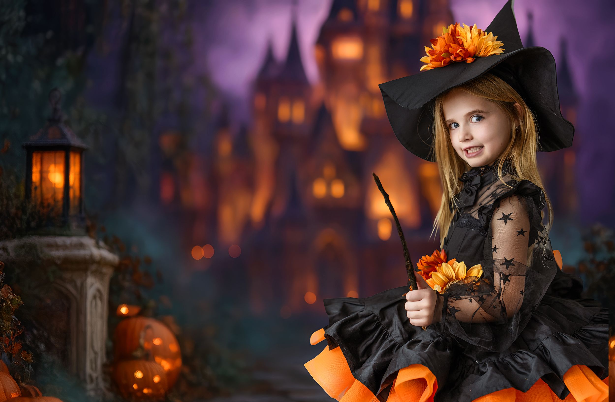 A girl in a witch dress with a wand standing in front of a darkly lit castle.
