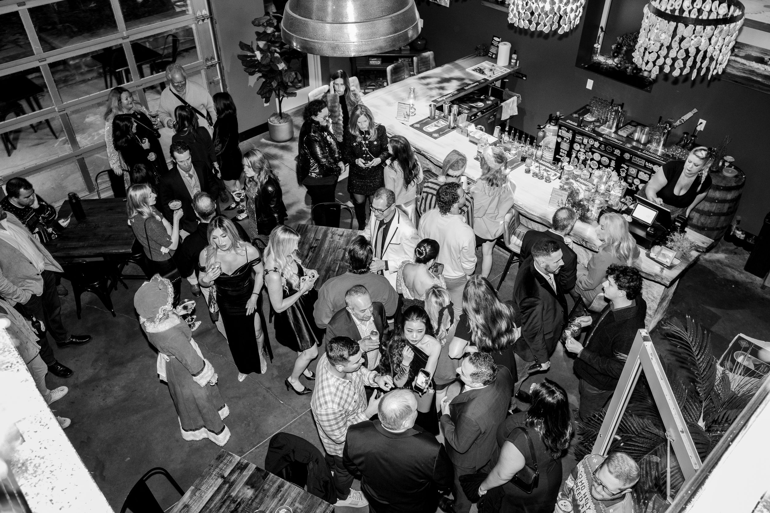 A black and white photo collage showing a busy restaurant dining room with customers and staff interacting.