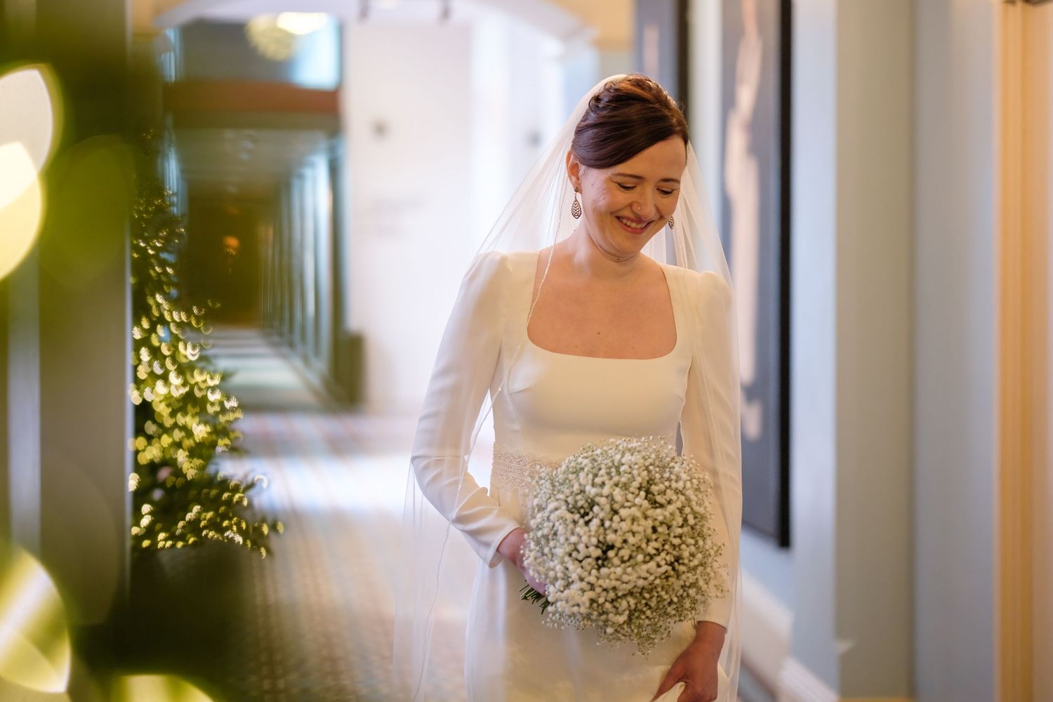 A wedding scene with soft lighting and floral decorations creating a romantic atmosphere.