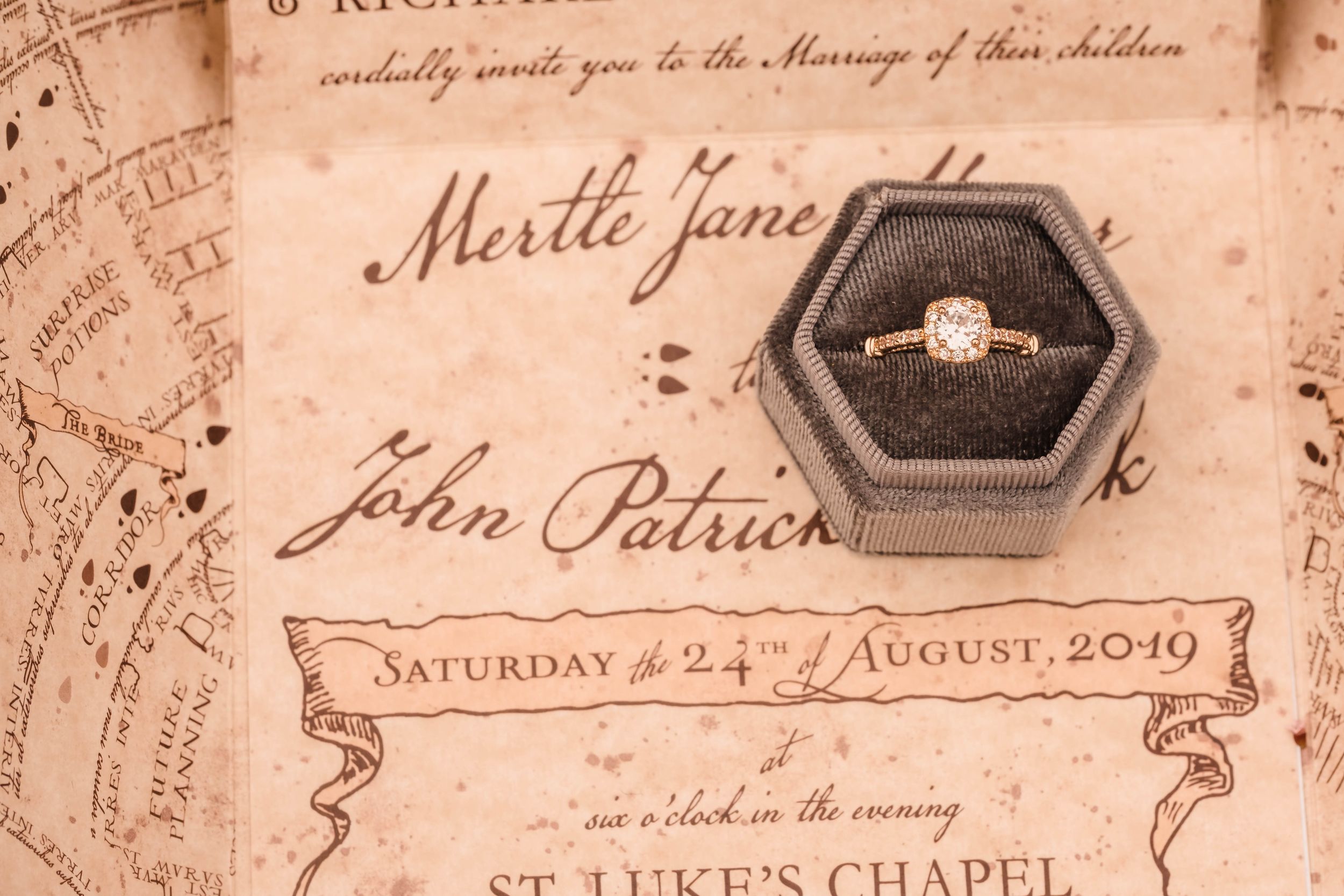 Close-up of PaperTruly stationery with vintage textures for a fantasy-inspired wedding concept. In golden gate park.