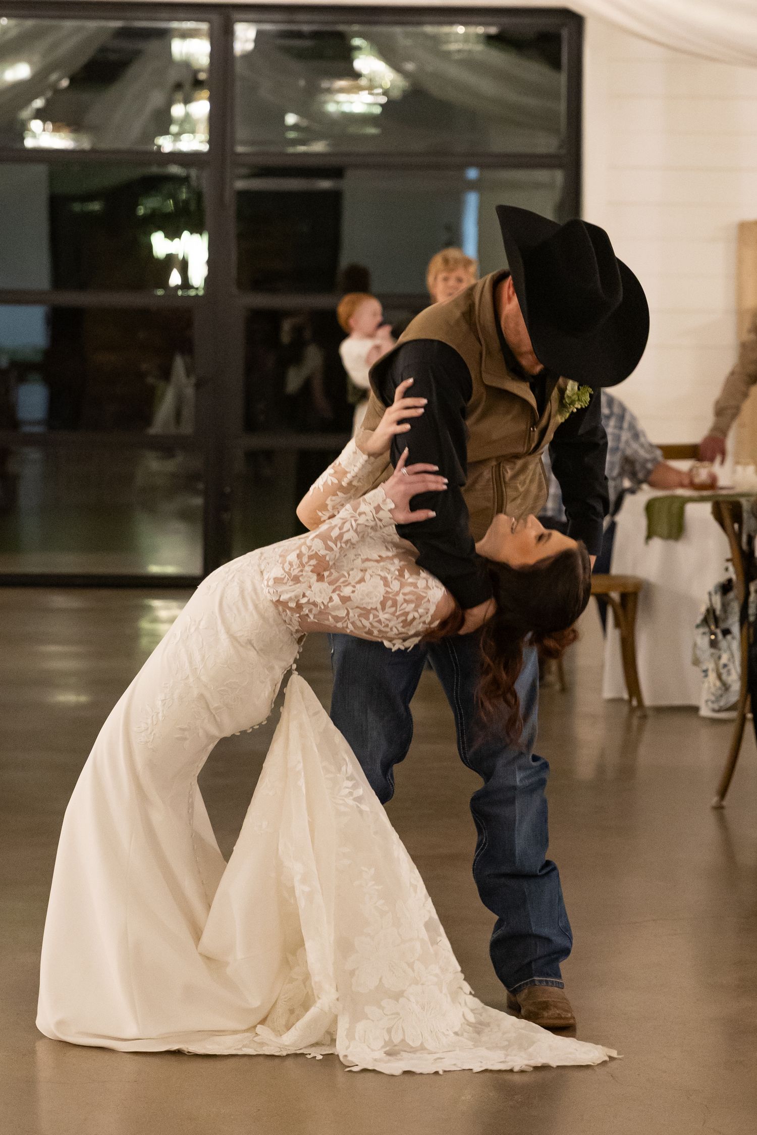 groom dipping bride after first dance at The Diamond Wedding venue in Cumby, Texas