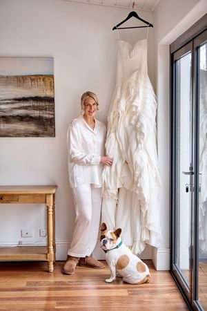 A series of white-themed interior photos showing a bathrobe and dog against minimalist decor with wooden accents.