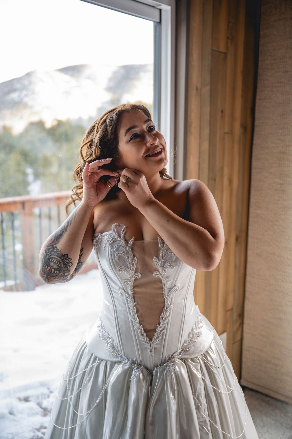A series of emotional moments captured in a white lace wedding dress against wooden interior walls.