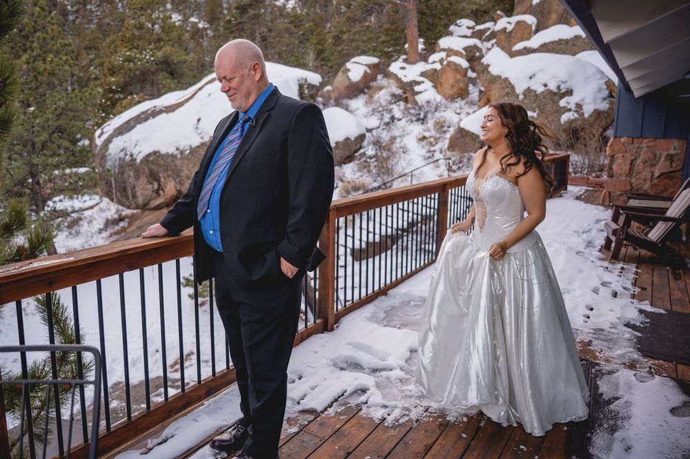 Wedding ceremony moments captured in a snowy mountain setting with scenic winter views.