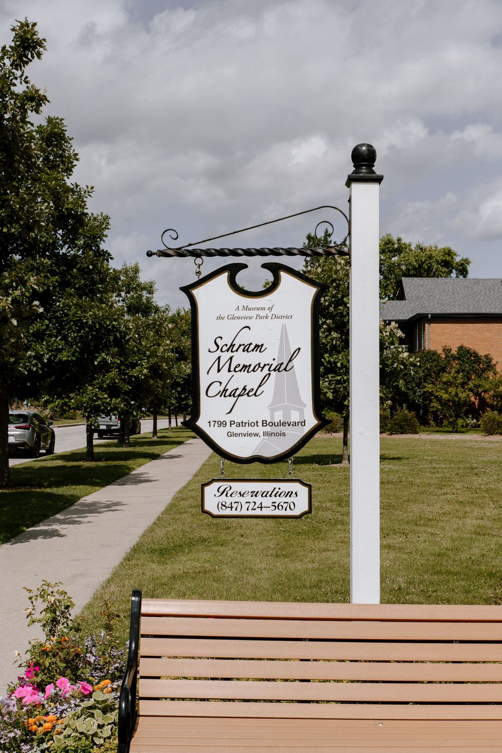 Sakran Memorial Chapel exterior sign and entrance path on a cloudy day.