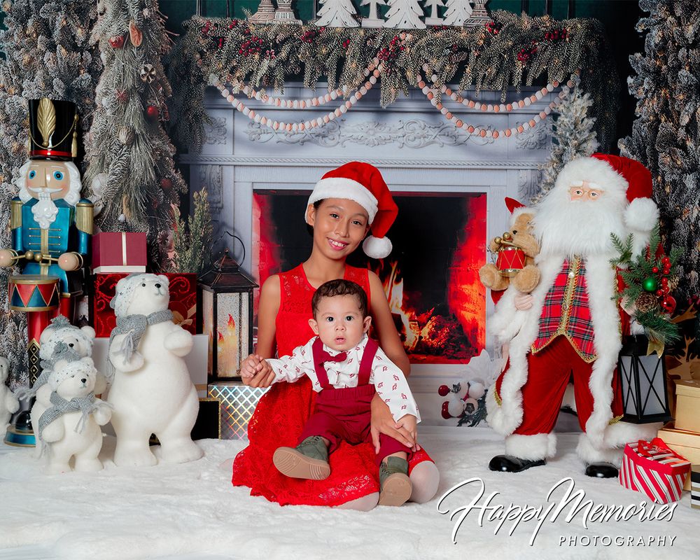 Festive holiday photo set with white reindeer and Christmas decorations.