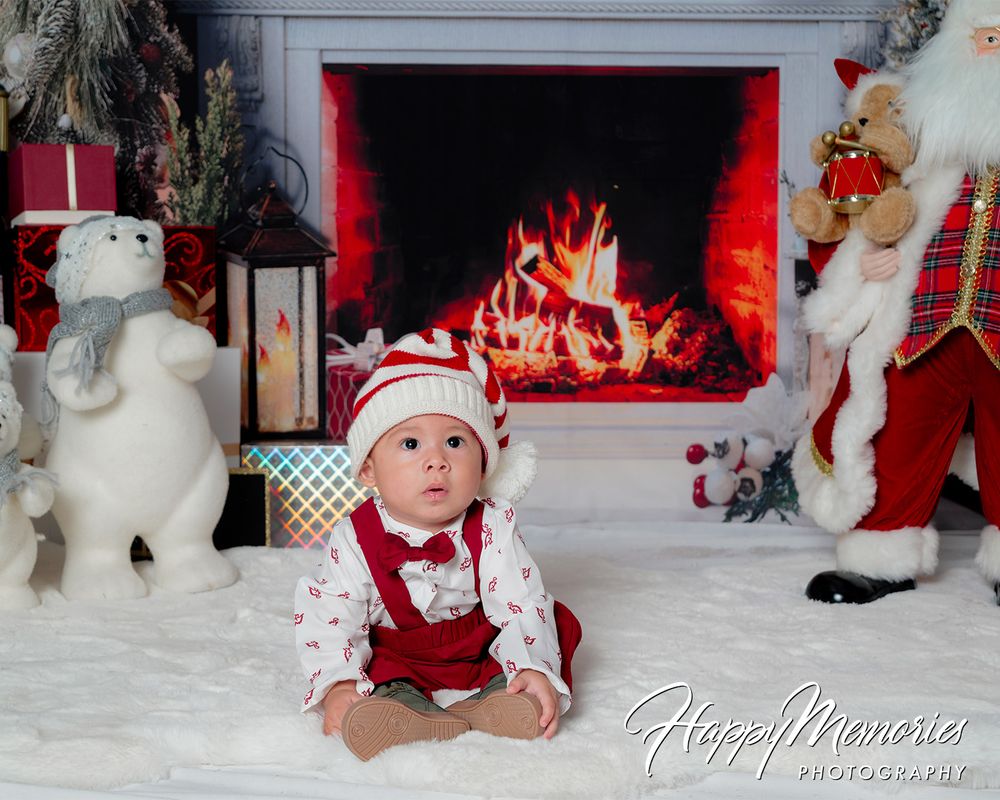 Christmas display with white reindeer decorations and wrapped presents.