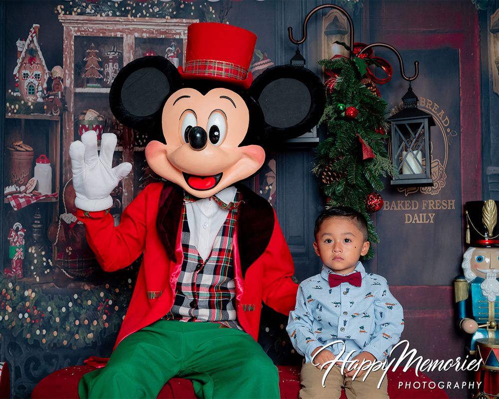 Christmas scene with Mickey Mouse character and holiday decorations.
