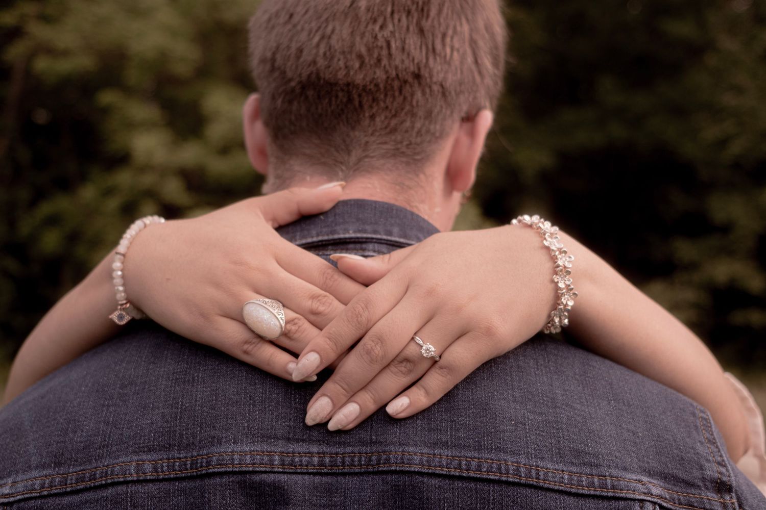 Close-up detail shots of hands and embraces showing intimate moments of connection.