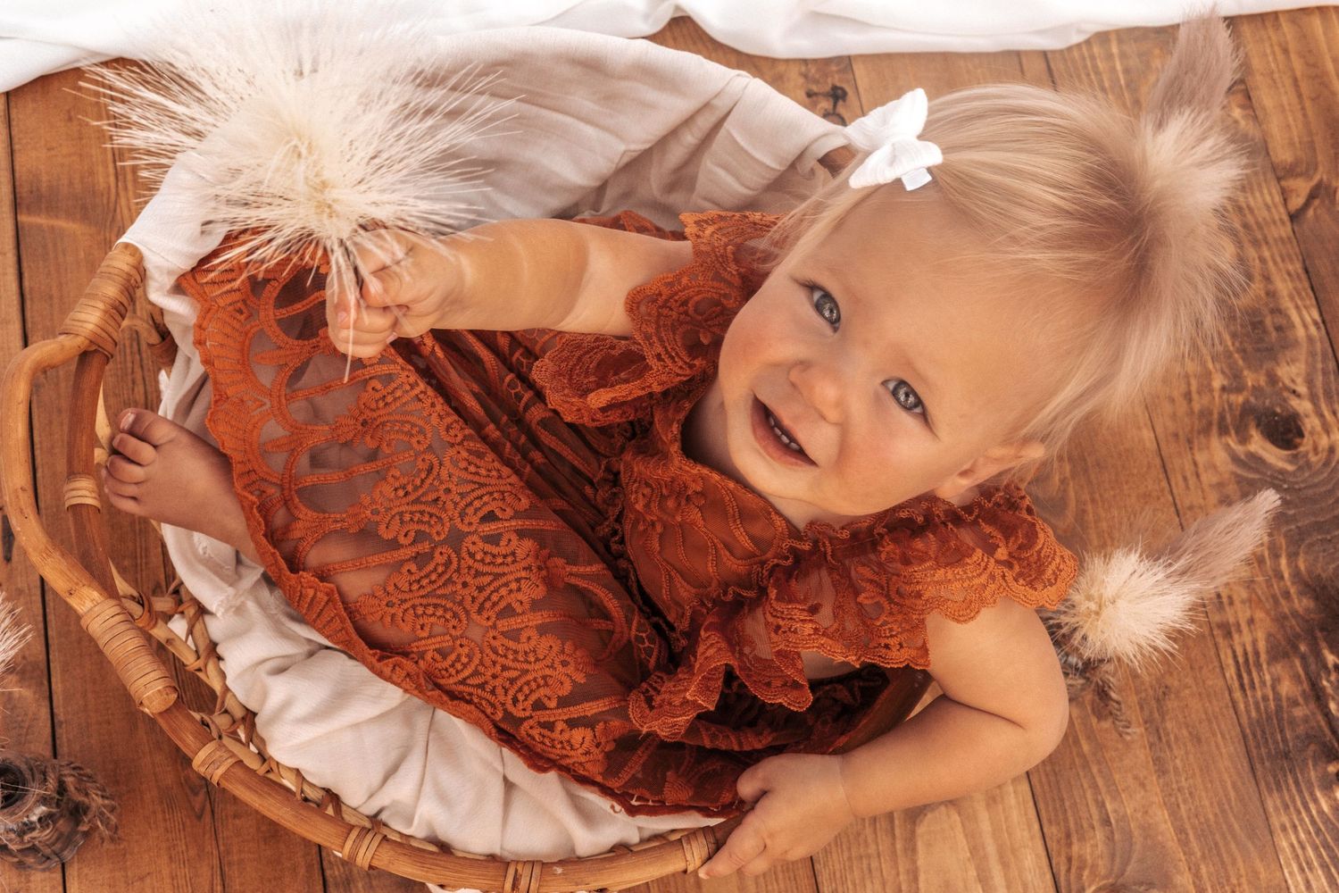 Creative milestone portraits with rustic orange and brown tones and lace accents.