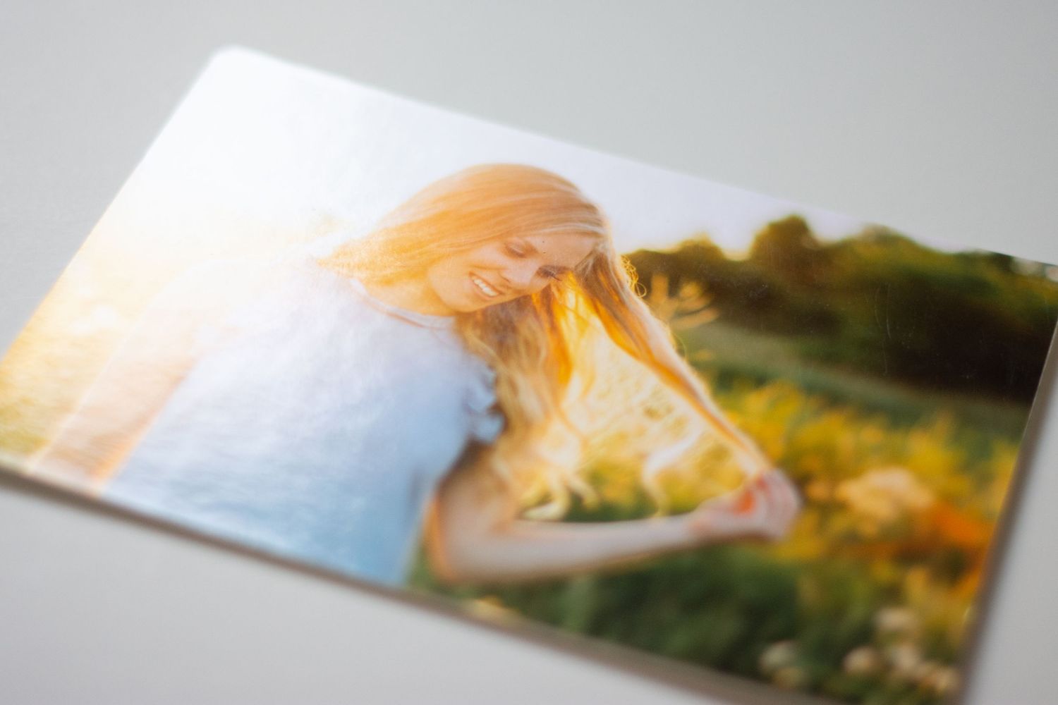 Series of printed photographs laid out in sequence showing outdoor portrait sessions.