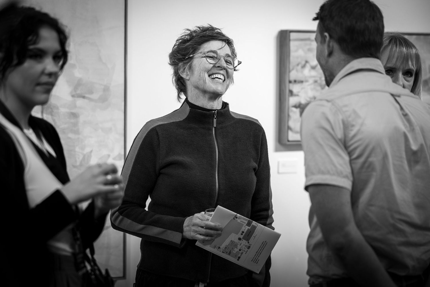 Black and white photos show people having conversation while drinking in a social setting.