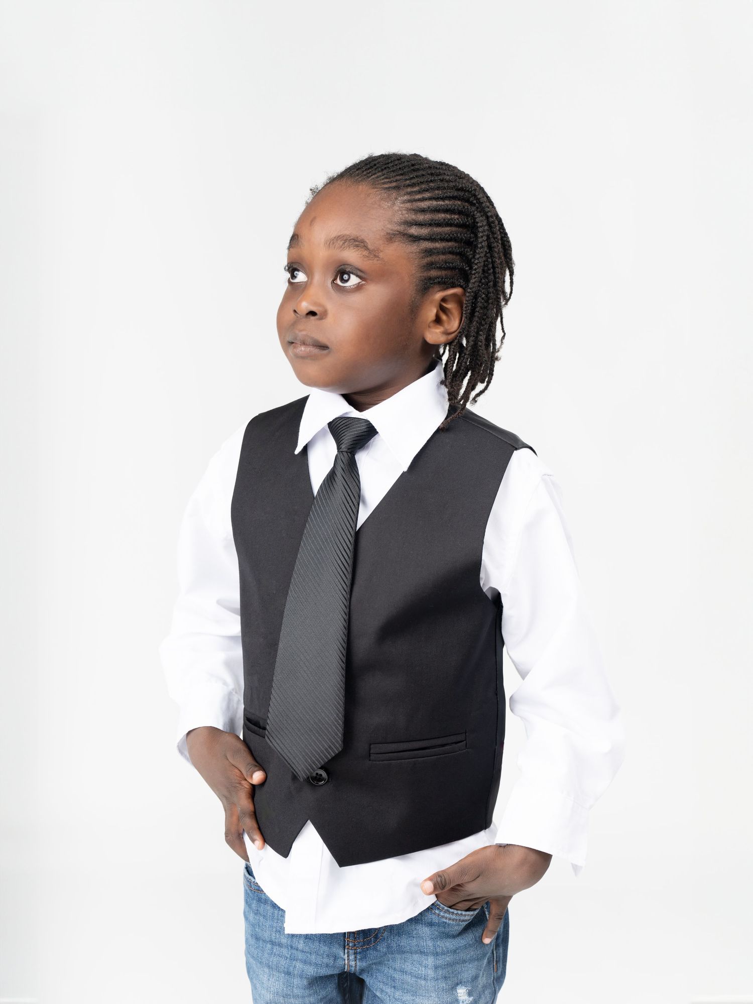 Professional portrait series showing a formal business attire look against a white background.