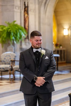 A sequence showing emotional reactions during a wedding ceremony in an elegant indoor venue.