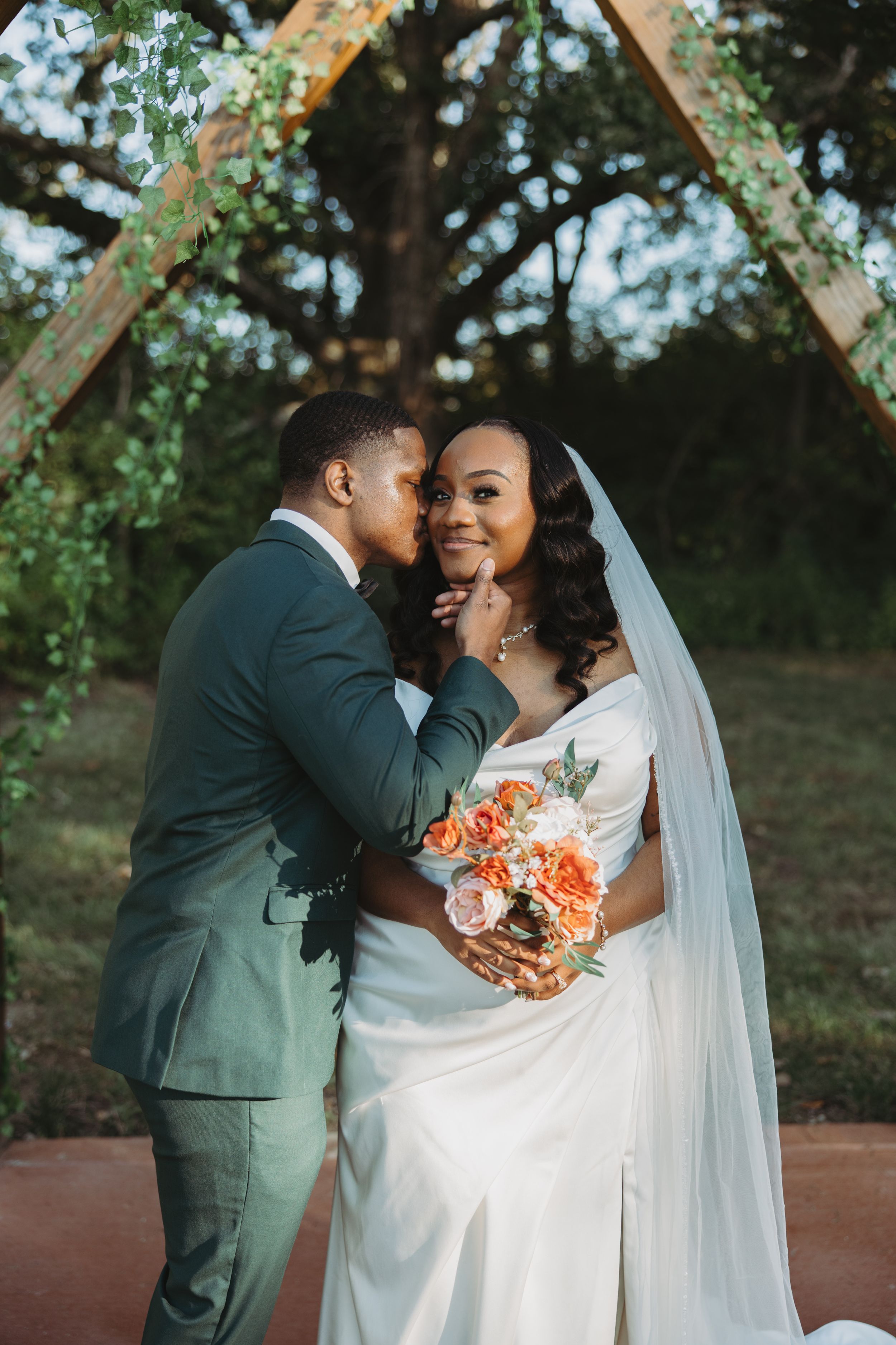 A romantic outdoor wedding moment captured in a series of intimate poses beneath an arched trellis.