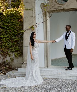 Creative wedding portraits showing elegant dance poses in a white architectural setting with romantic lighting.