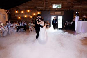 Fog machine creates atmospheric effects on a dance floor at a wedding reception.
