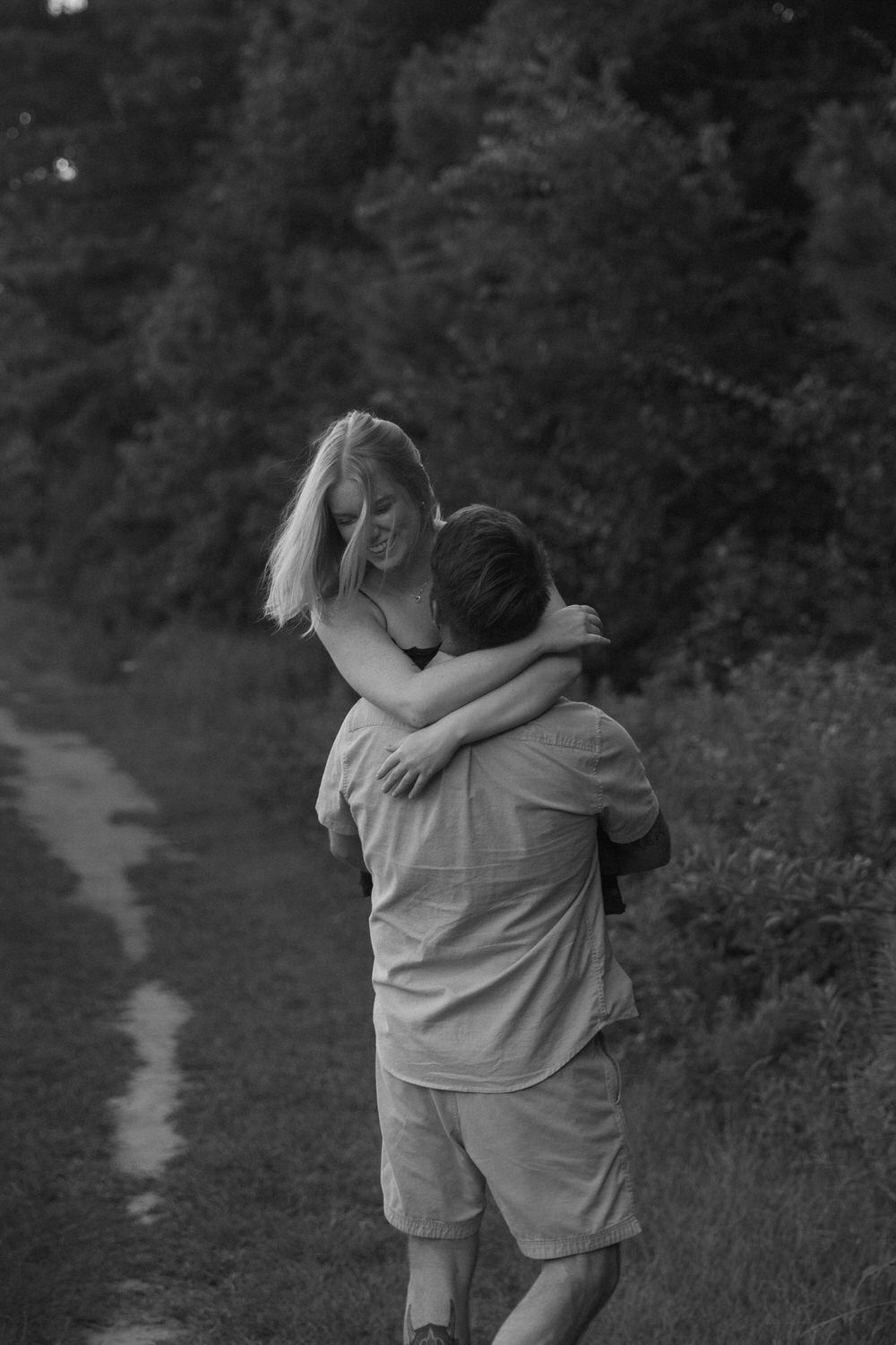 Romantic embrace captured in the North Georgia mountains at golden hour.