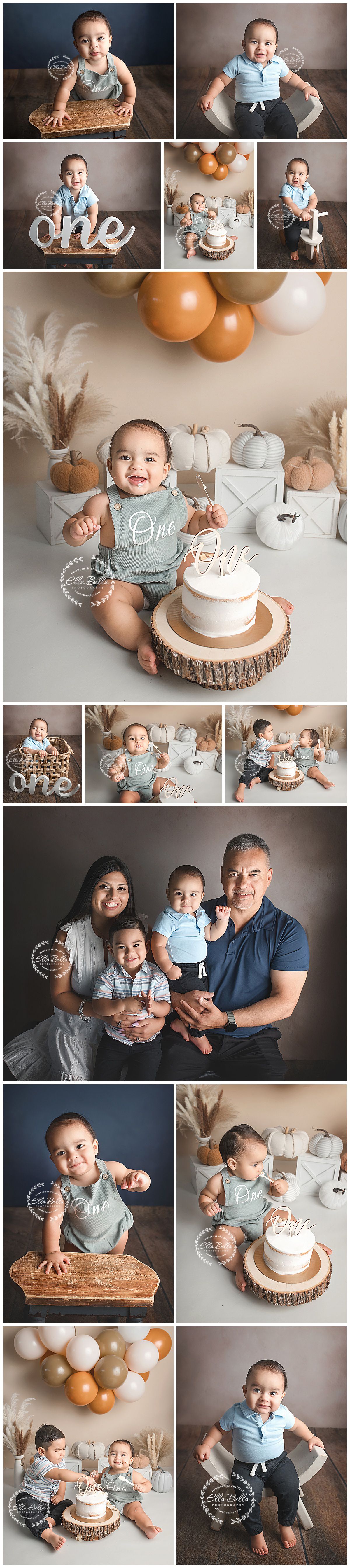 First birthday celebration setup with rustic cake on wood slice, pampas grass, blue and white balloons in a cozy studio setting.