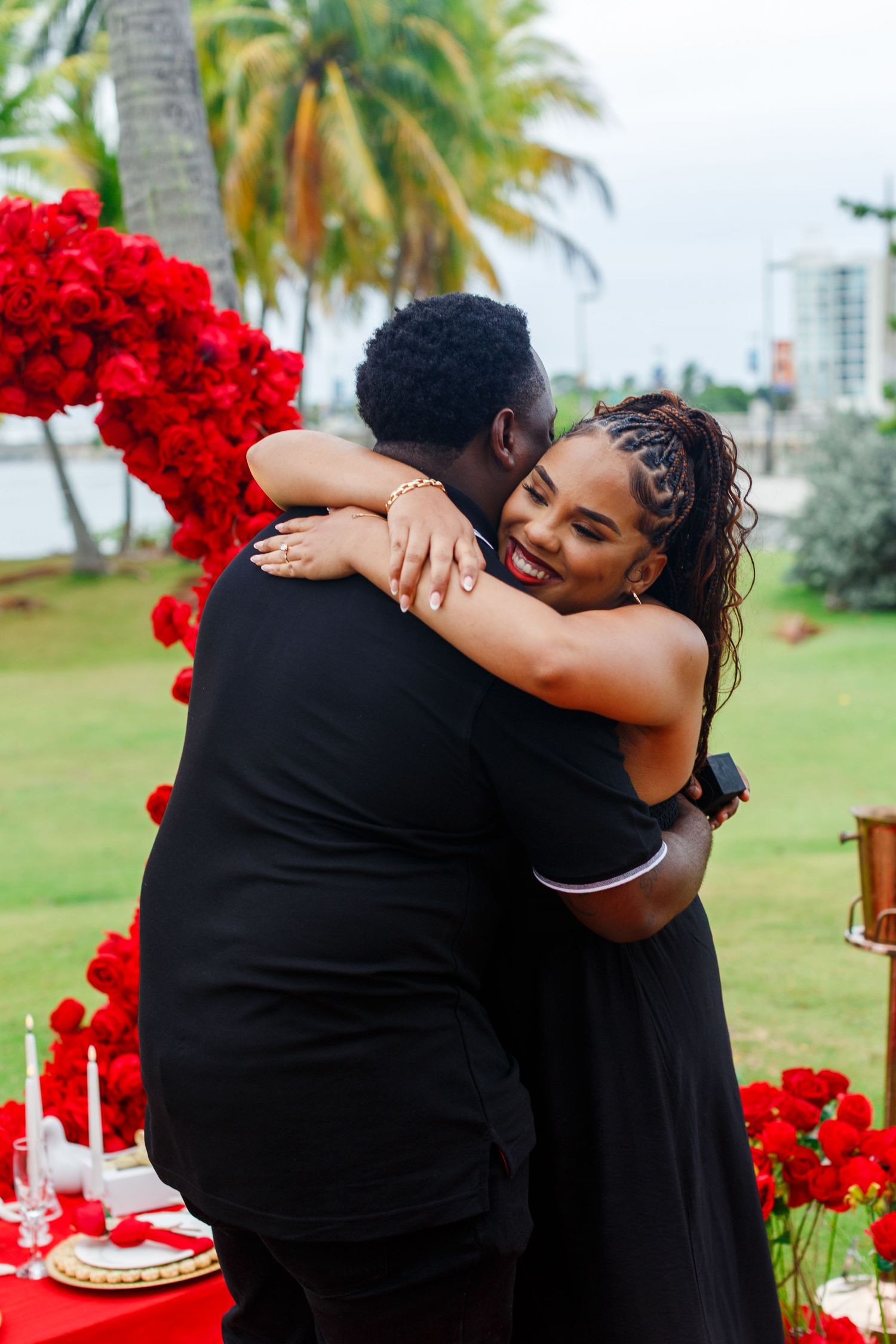 Couple hugging after marriage proposal.