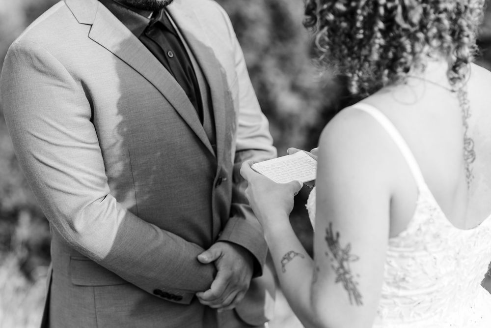 Romantic black and white wedding photo series showing intimate moments of a bride and groom during their special day.
