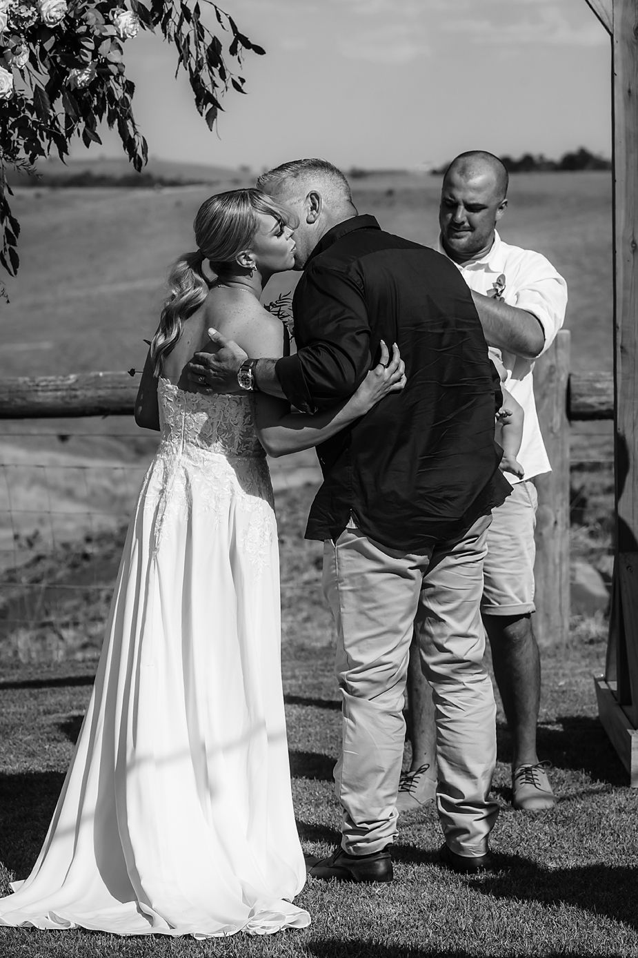 Series of candid outdoor wedding photographs showing moments between wedding couple in black and white style.