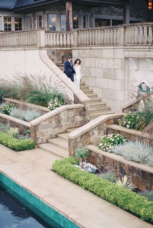 Wedding photo sequence showing couple walking along stone steps near a swimming pool at an elegant venue.
