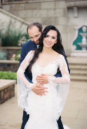 A sequence of intimate wedding portraits showing a couple embracing under stone columns.
