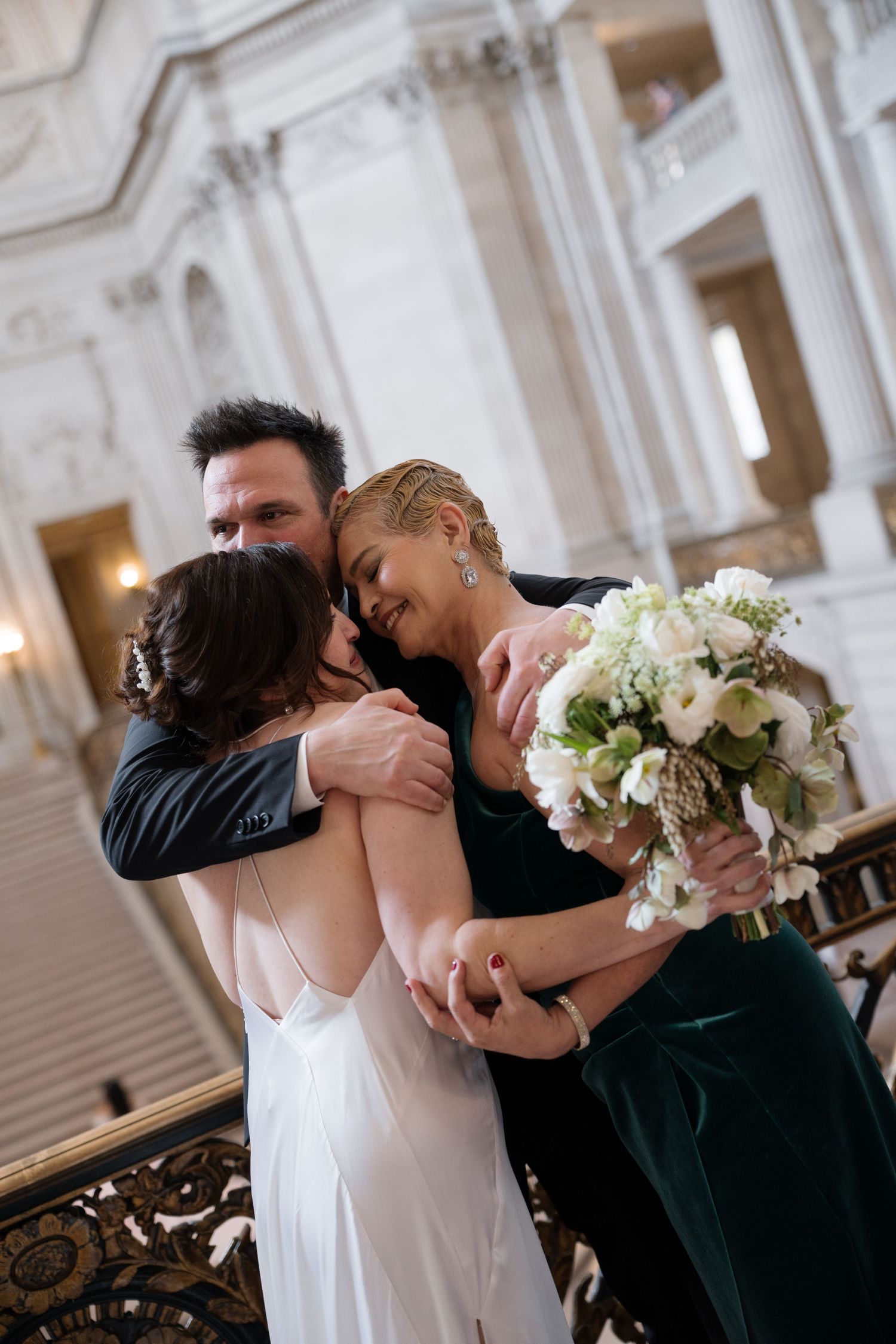 A romantic sequence of wedding photos shows the newlyweds sharing sweet moments and embraces in an elegant venue.