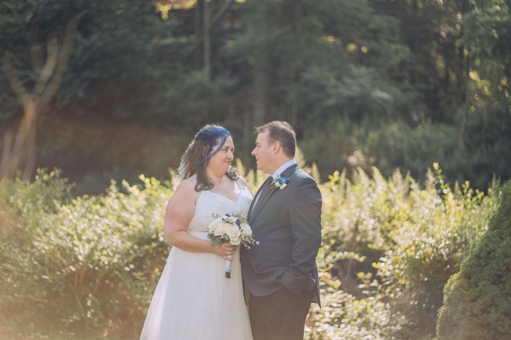 Couple together in front of a lush green background  | Shannon Konek, Pittsburgh Photographer