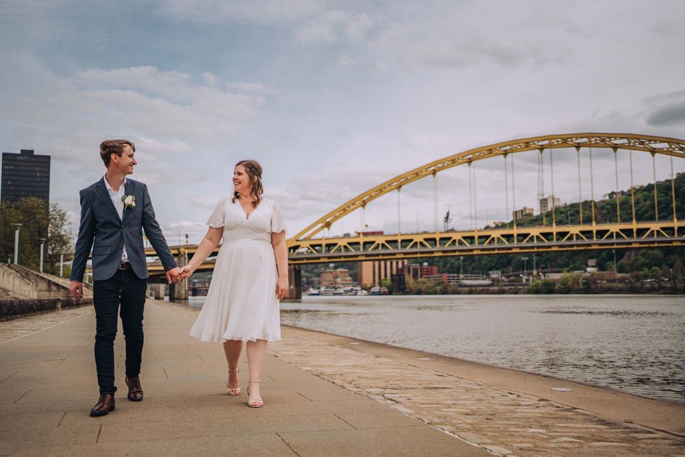Elopement couple walking along the river in Pittsburgh's Point State Park | Shannon Konek, Pittsburgh Photographer