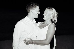 Black and white romantic dance moment at wedding rehearsal.