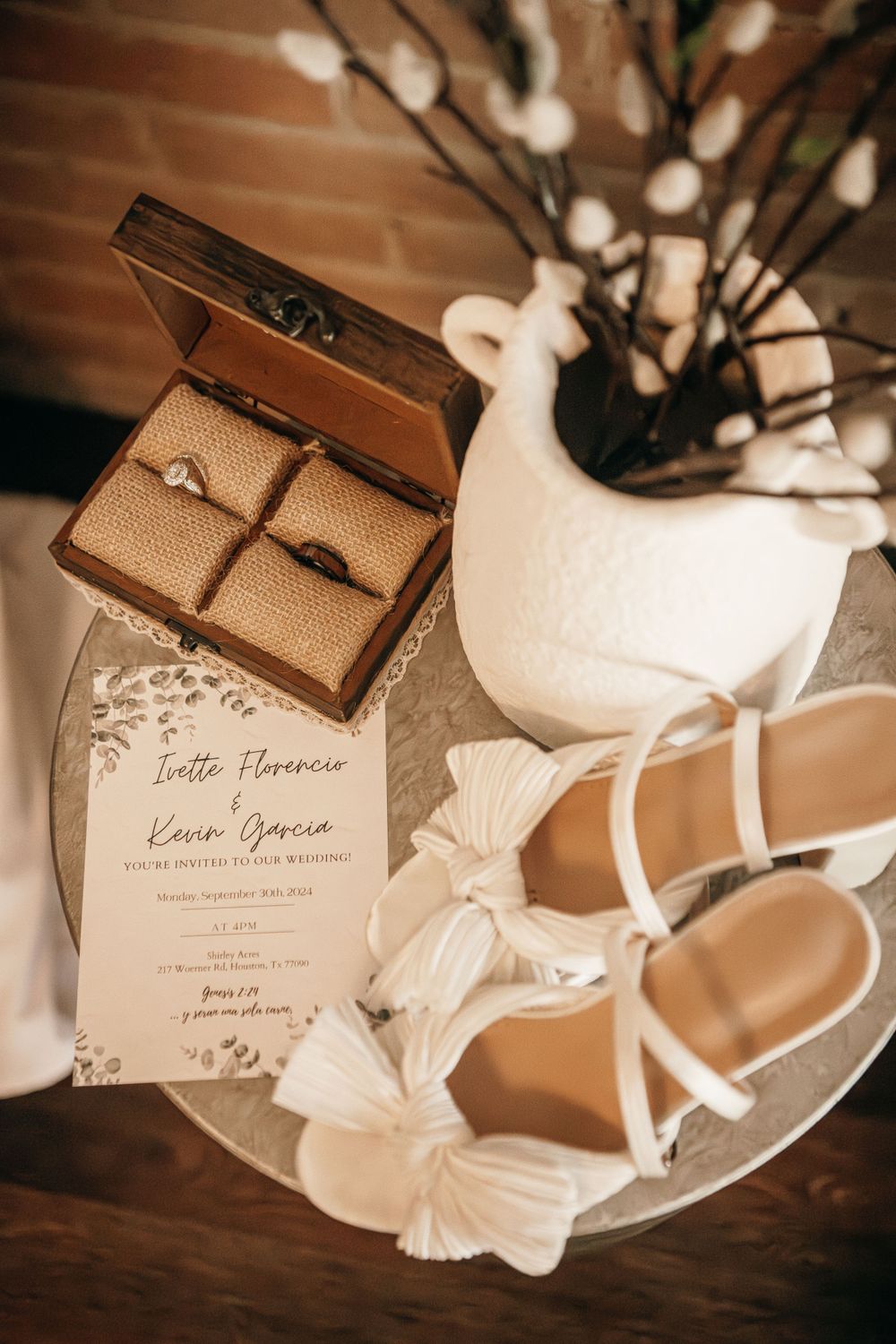 Wedding invitations and details arranged with soft lighting and decorative elements.