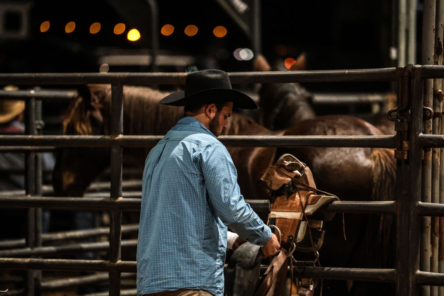 Behind the chutes getting ready for his retirement ride. Bronc Rider