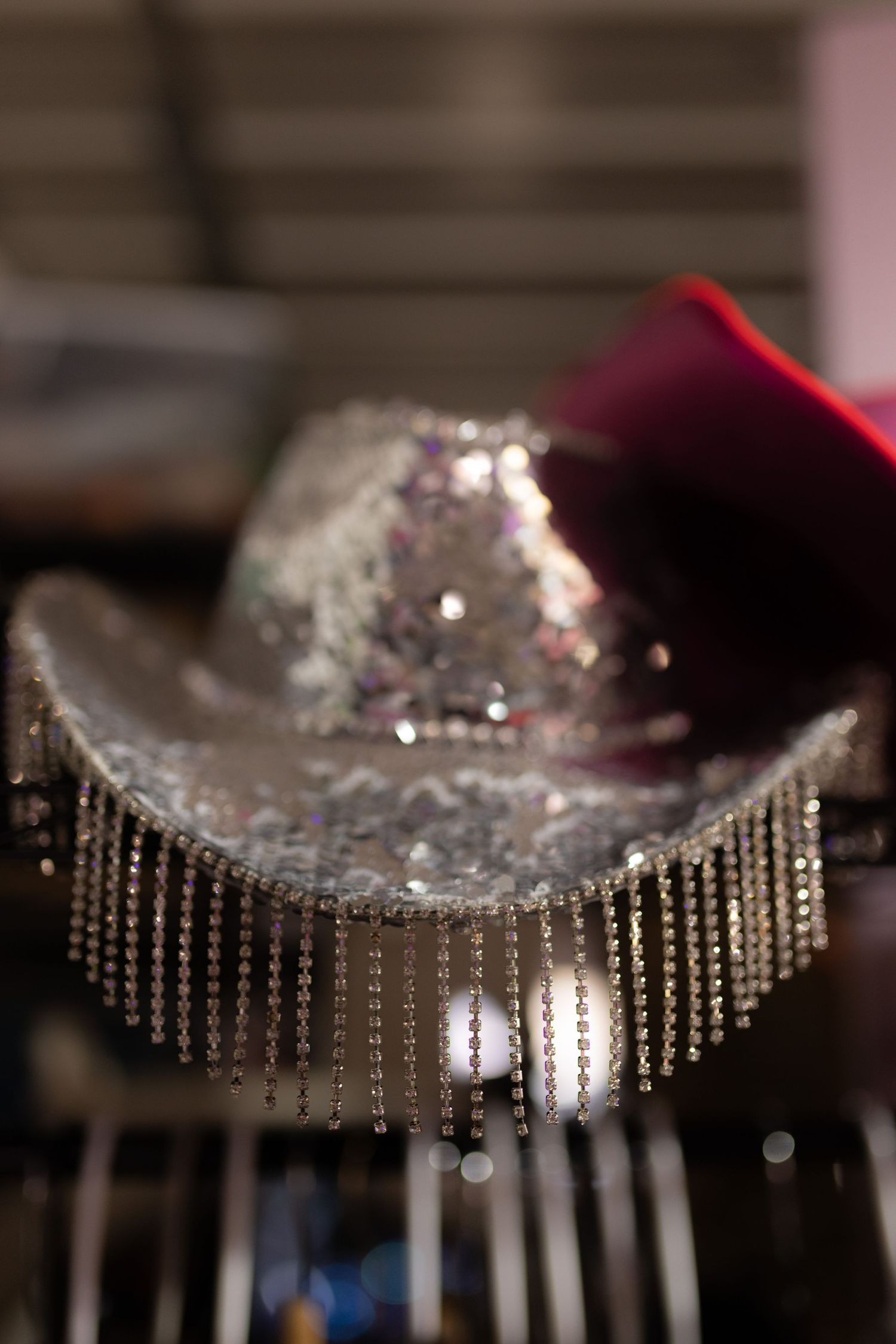 Close-up of an elegant crystal beaded chandelier with dramatic lighting.