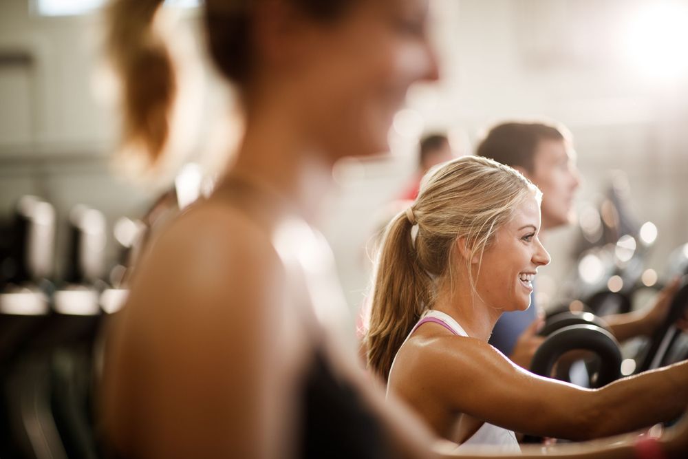 Group workout session at modern fitness center.