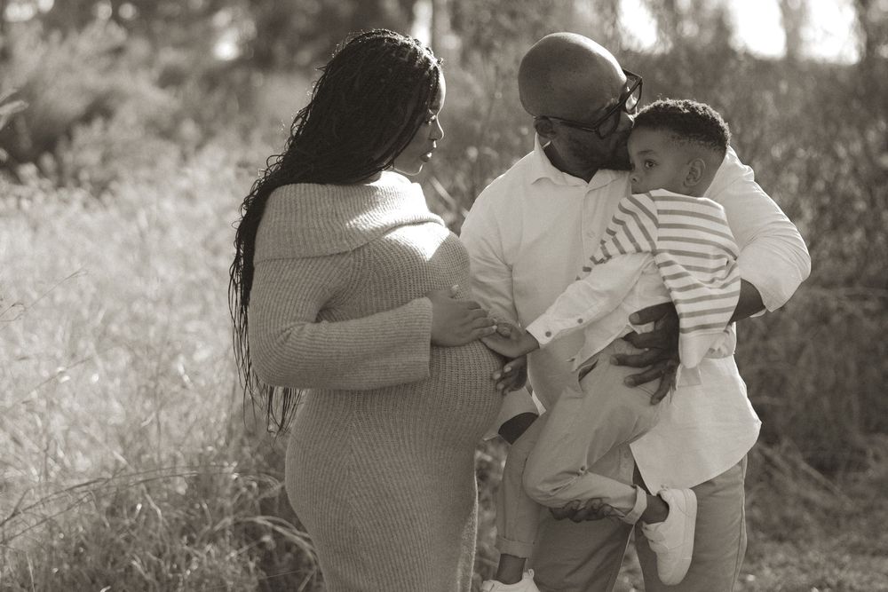 Black and white photo series showing intimate moments between two people embracing in an outdoor setting.