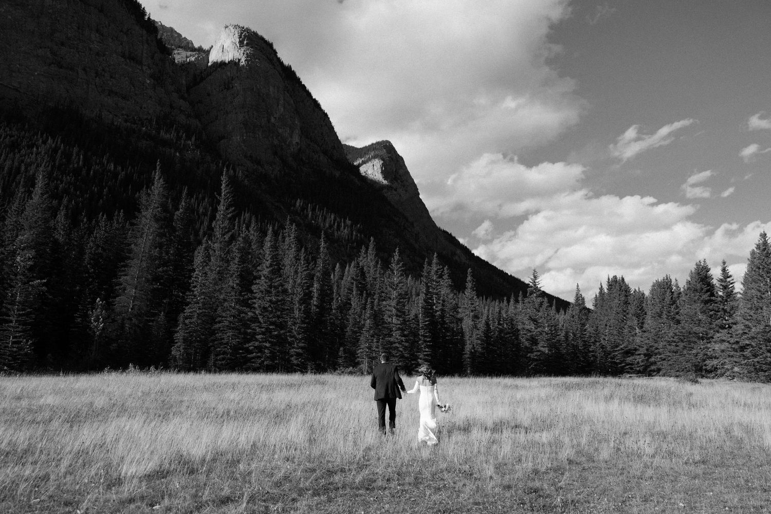 Documentary-style destination wedding photo in the mountains of Banff, Alberta