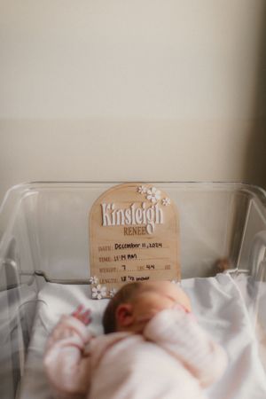 Newborn in hospital bassinet for Fresh 48 photography session captured by Maryland family photographer Mallory Bramlett.