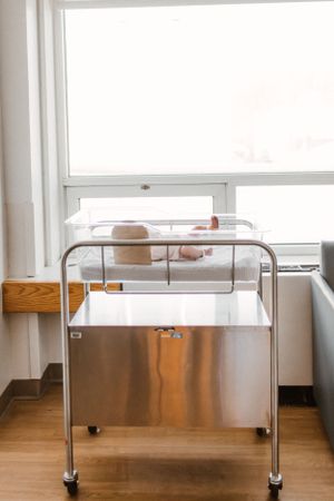 Newborn in hospital bassinet for Fresh 48 photography session captured by Maryland family photographer Mallory Bramlett.