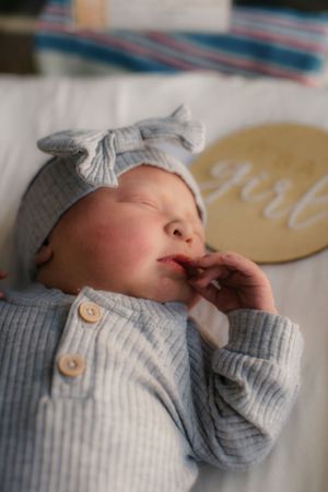 Newborn in hospital bassinet for Fresh 48 photography session captured by Maryland family photographer Mallory Bramlett.