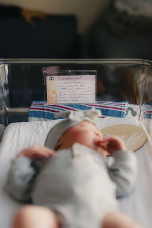 Newborn in hospital bassinet for Fresh 48 photography session captured by Maryland family photographer Mallory Bramlett.